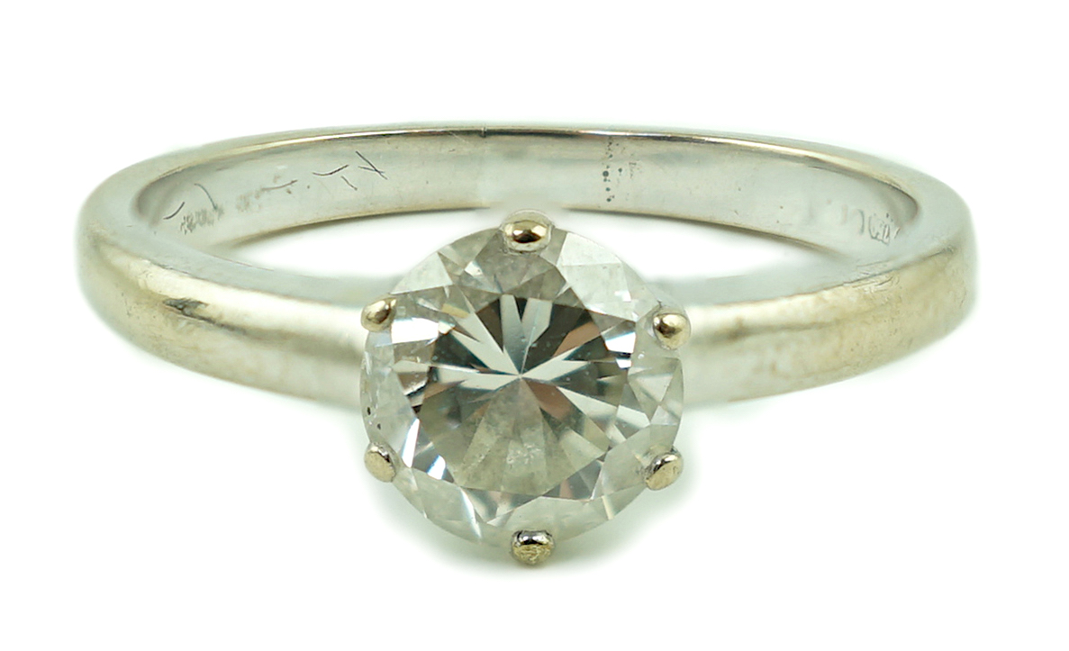 A modern 18ct white gold and solitaire diamond ring
